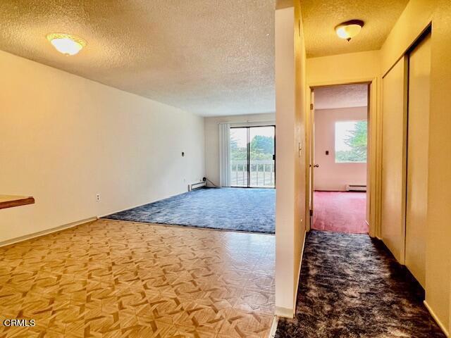 interior space featuring a textured ceiling