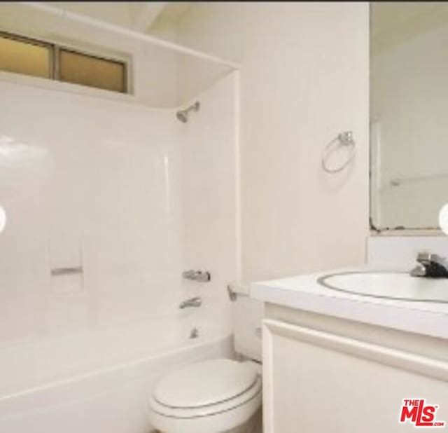 full bathroom featuring vanity,  shower combination, and toilet