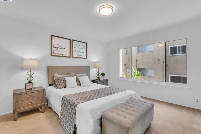 bedroom with light colored carpet