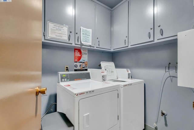 clothes washing area featuring separate washer and dryer