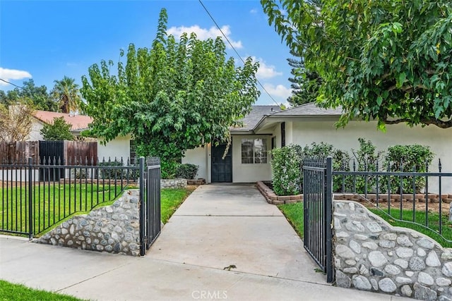 view of property hidden behind natural elements featuring a front yard