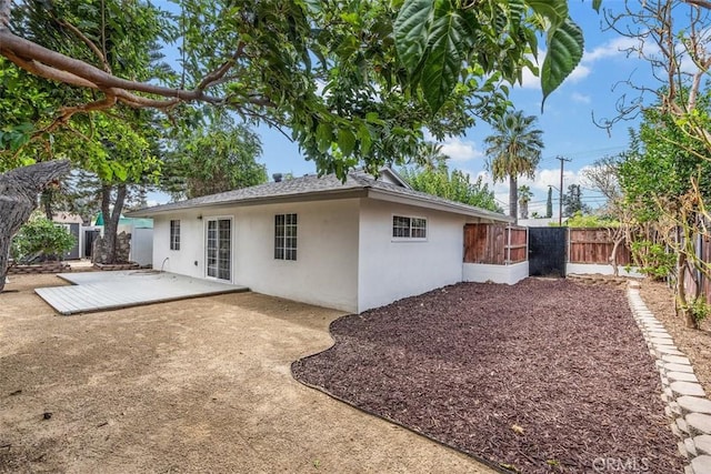 rear view of property featuring a patio area