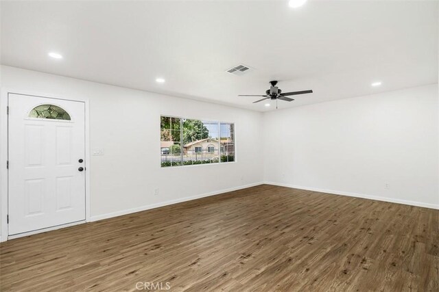 foyer entrance featuring ceiling fan and dark hardwood / wood-style floors