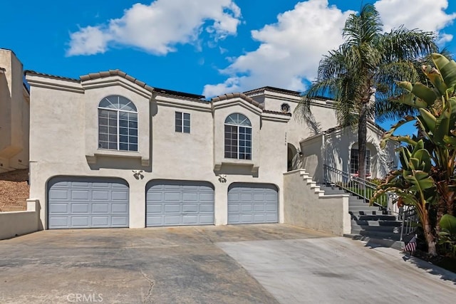 mediterranean / spanish house featuring a garage