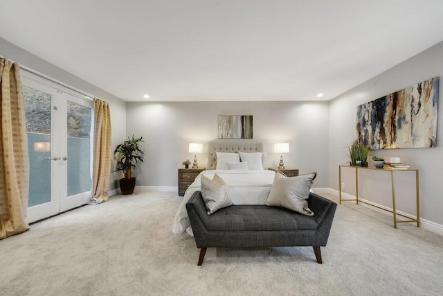 bedroom with access to outside, light carpet, and french doors