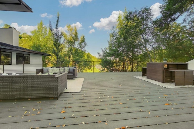 wooden deck featuring an outdoor living space