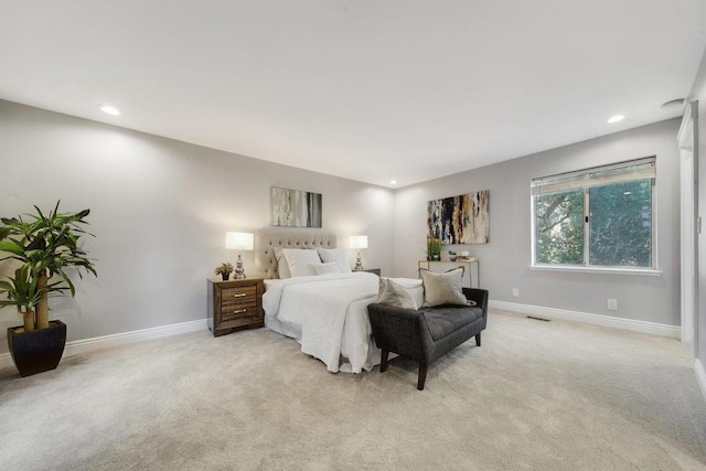 bedroom featuring light carpet