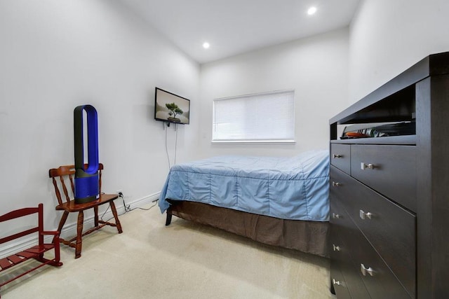 carpeted bedroom with lofted ceiling