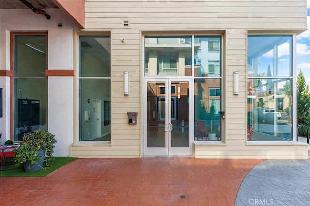 property entrance featuring a patio area