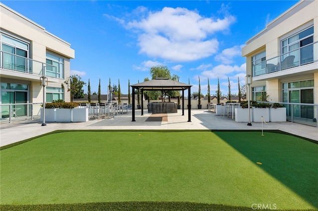 surrounding community with a patio area and a gazebo