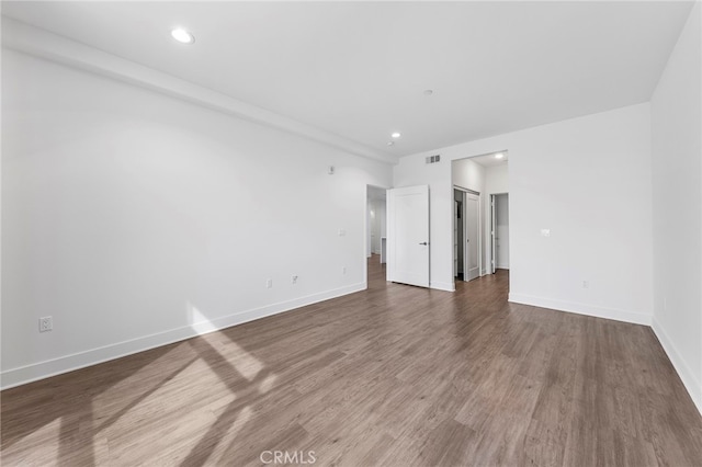 spare room featuring hardwood / wood-style floors