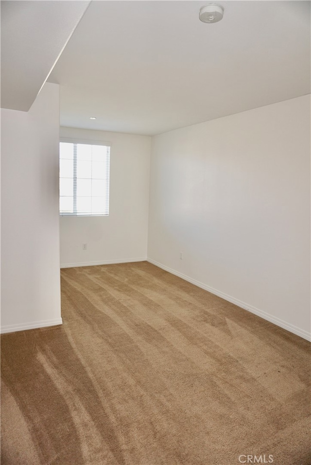 spare room featuring carpet flooring