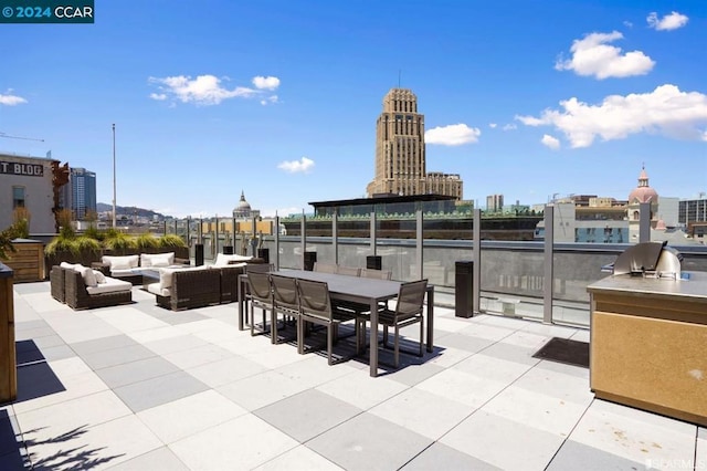 view of patio with outdoor lounge area, an outdoor kitchen, and grilling area