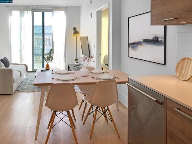 dining room with light hardwood / wood-style floors and plenty of natural light