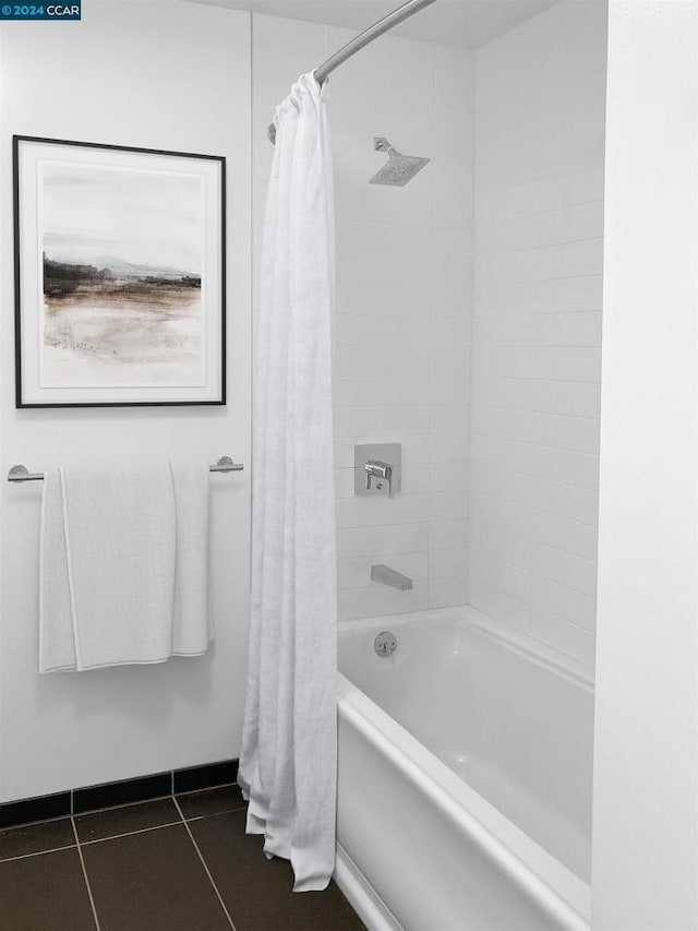 bathroom with tile patterned floors and shower / bathtub combination with curtain