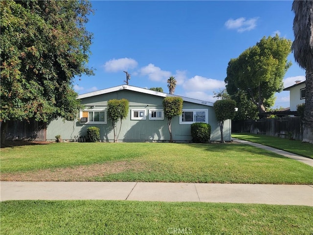 ranch-style house featuring a front lawn