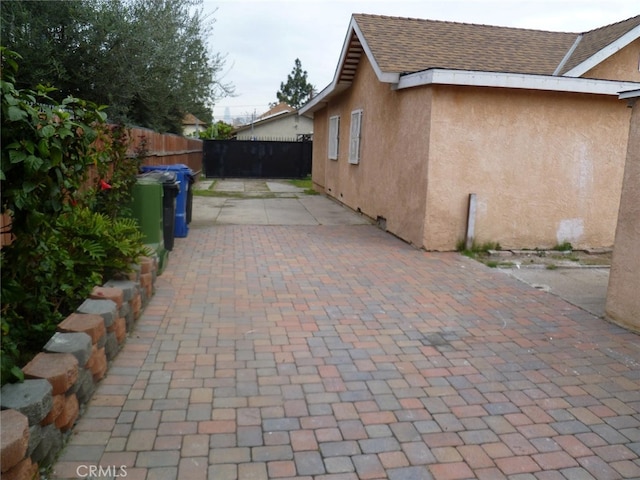 view of side of property featuring a patio