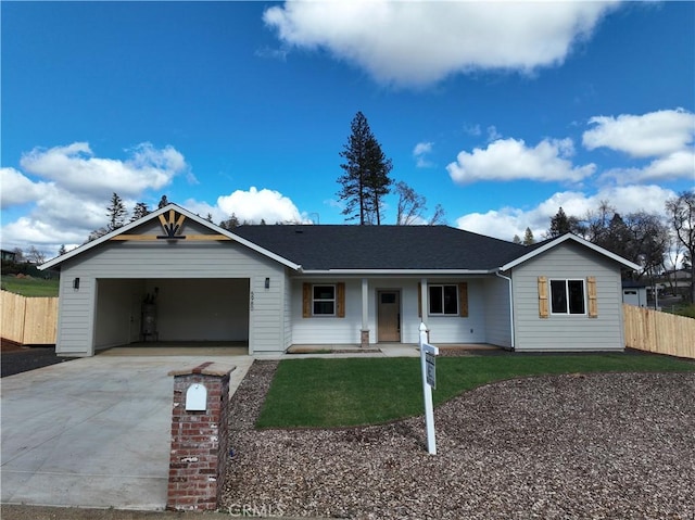 single story home with a front lawn, fence, concrete driveway, an attached garage, and a shingled roof