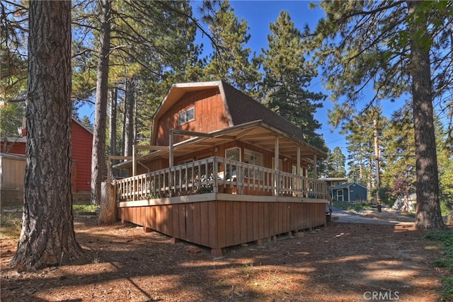 back of property with a porch