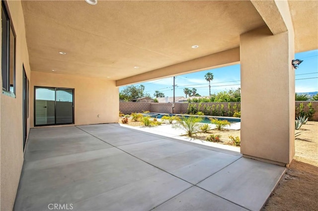 view of patio / terrace featuring a swimming pool