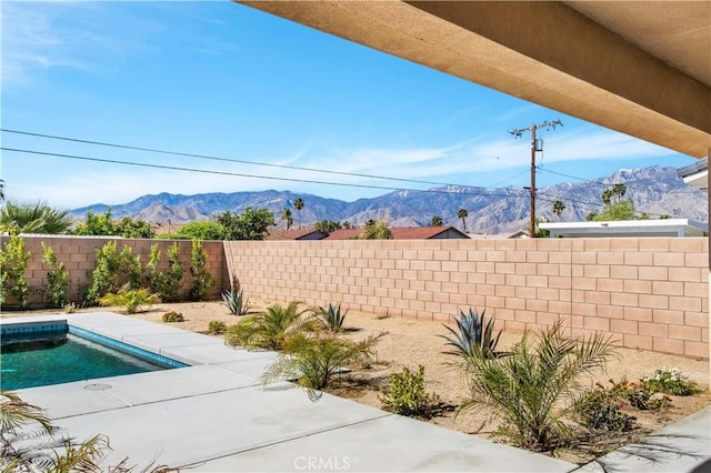 view of pool with a mountain view