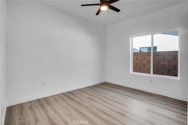 unfurnished room with ceiling fan and light wood-type flooring