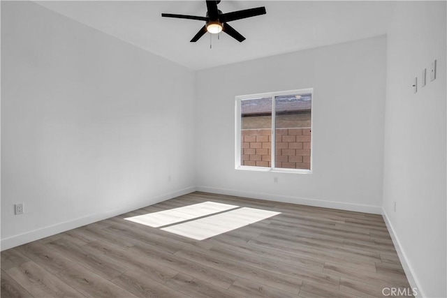 empty room featuring ceiling fan and light hardwood / wood-style floors