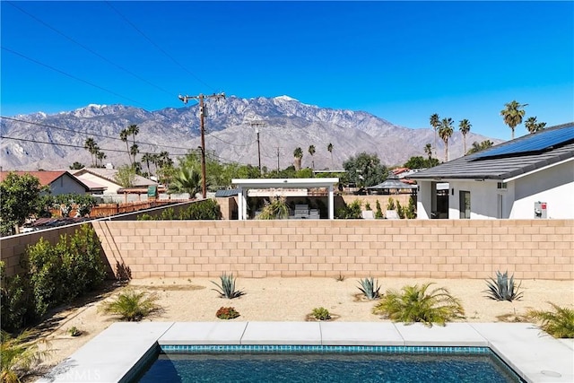 view of pool with a mountain view