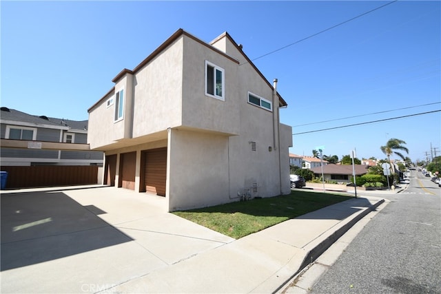 view of property exterior featuring a garage