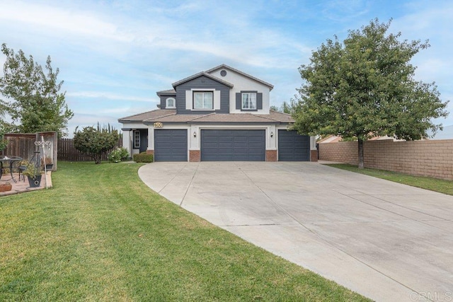 view of front of house with a garage and a front lawn