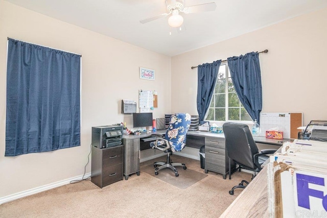 carpeted office with ceiling fan