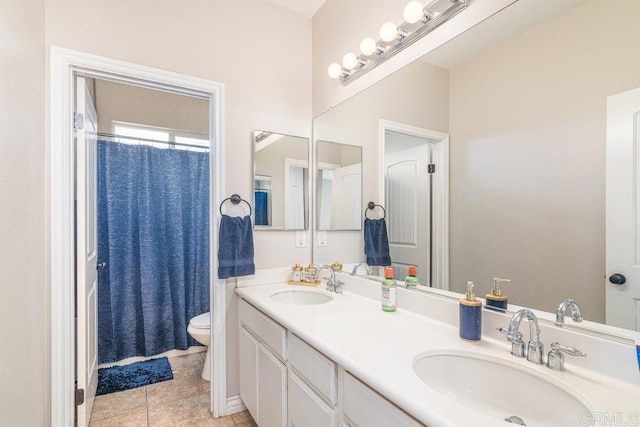 bathroom with tile patterned flooring, vanity, toilet, and a shower with curtain