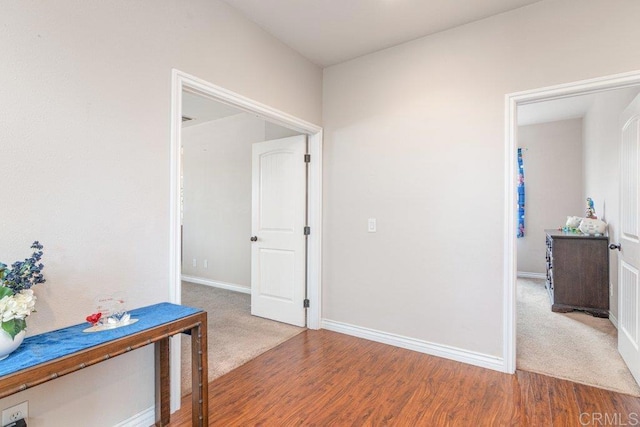 hallway featuring wood-type flooring