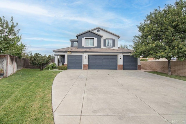 view of front facade featuring a front yard and a garage