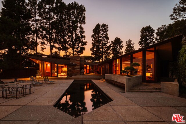 view of patio terrace at dusk