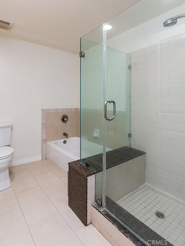 bathroom with separate shower and tub, toilet, and tile patterned floors