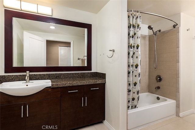 bathroom featuring shower / bathtub combination with curtain, tile patterned floors, and vanity