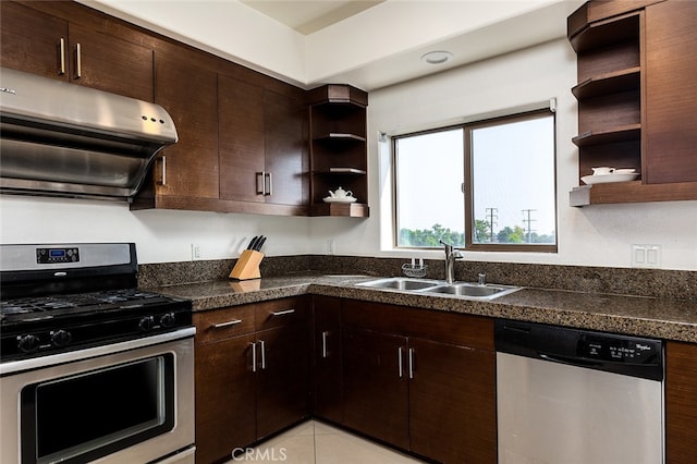 kitchen with dark brown cabinets, light tile patterned flooring, sink, range hood, and appliances with stainless steel finishes