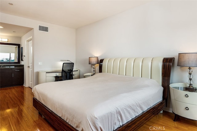 bedroom with wood-type flooring