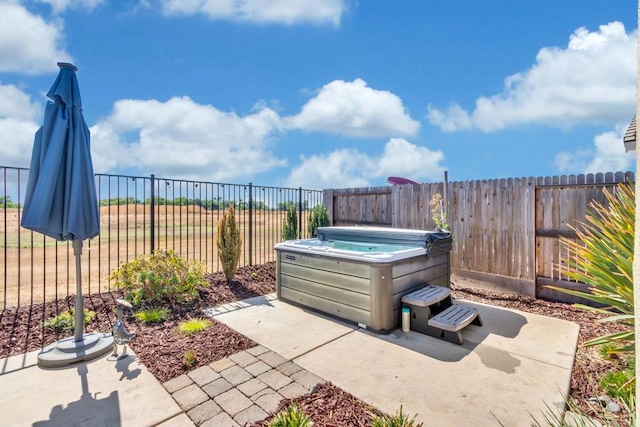 view of patio / terrace featuring a hot tub