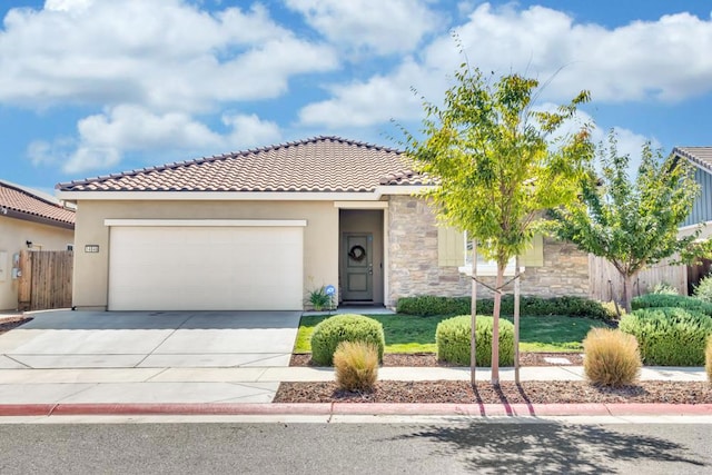 mediterranean / spanish-style house with a garage