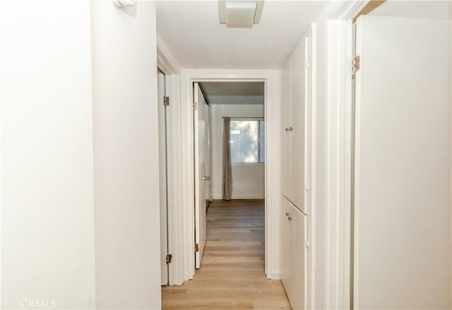 hall with light hardwood / wood-style floors