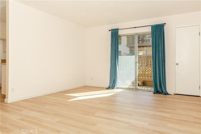 empty room with light wood-type flooring