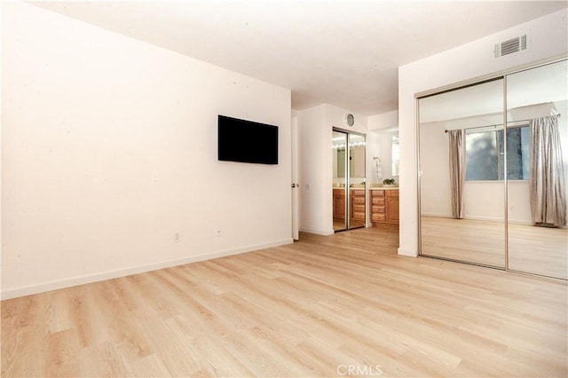 unfurnished bedroom featuring light hardwood / wood-style flooring