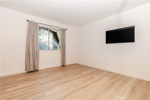 empty room with light hardwood / wood-style floors