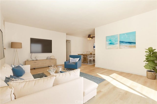 living room with hardwood / wood-style flooring and ceiling fan