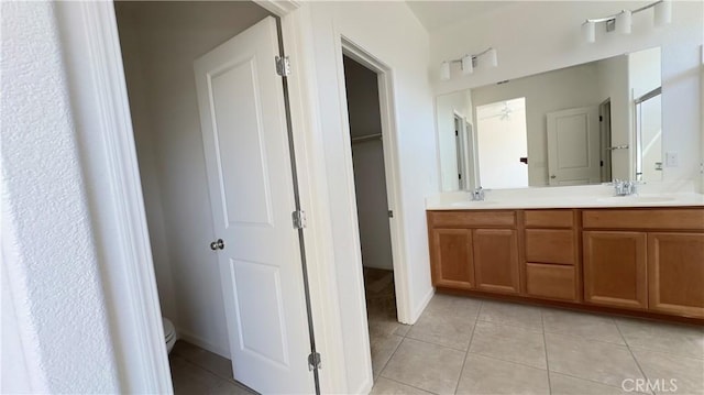 bathroom with vanity, tile patterned floors, and toilet