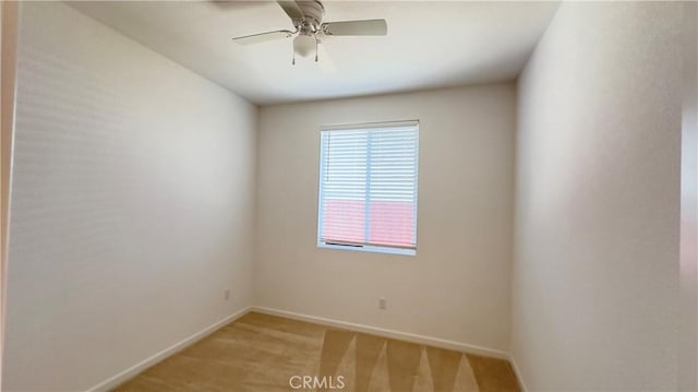 spare room with ceiling fan