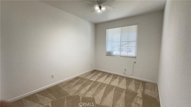 carpeted empty room with ceiling fan