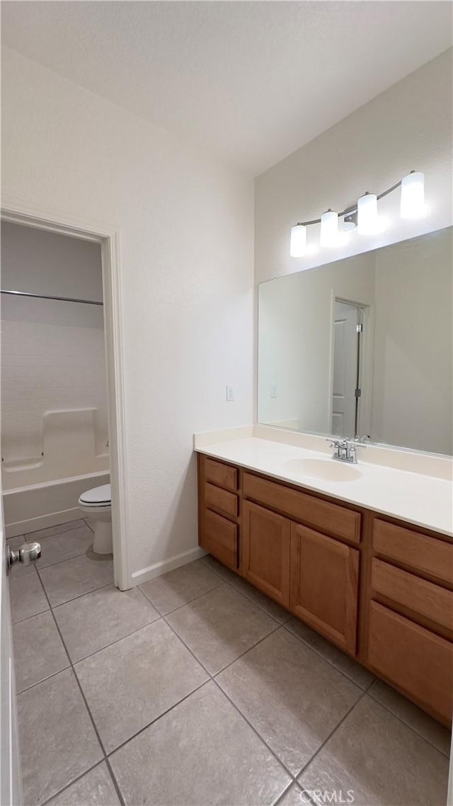 full bathroom featuring shower / tub combination, vanity, tile patterned floors, and toilet